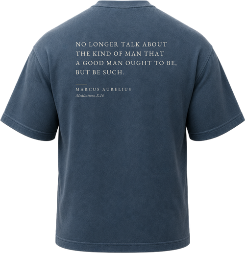 Pigment Midnight Navy
Back view of a faded, dark navy heavyweight cotton t-shirt cut in an intentionally oversized, boxy shape. The garment features architecturally balanced typography printed in Warm Parchment ink. The printed text reads: "NO LONGER TALK ABOUT THE KIND OF MAN THAT A GOOD MAN OUGHT TO BE, BUT BE SUCH." with the attribution "MARCUS AURELIUS" and "Meditations, X.16" directly underneath in a classic serif font.