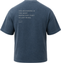 Pigment Midnight Navy
Back view of a faded, dark navy heavyweight cotton t-shirt cut in an intentionally oversized, boxy shape. The garment features architecturally balanced typography printed in Warm Parchment ink. The printed text reads: "THE BEGINNING IS THE MOST IMPORTANT PART OF ANY WORK." with the attribution "PLATO" and "Republic, II" directly underneath in a classic serif font.